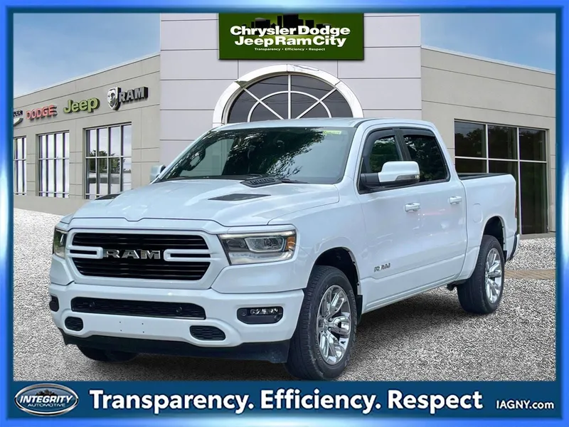 2023 RAM 1500 Laramie Crew Cab 4x4 5'7' Box in Bright White Clearcoat — front three-quarter view