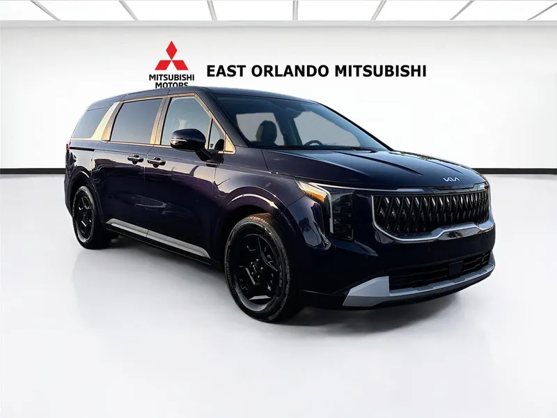 2025 Kia Carnival LXS in Deep Chroma Blue — front three-quarter view