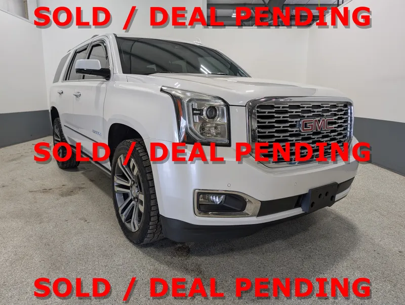 2018 GMC Yukon Denali in White — front three-quarter view
