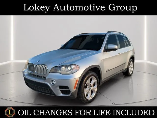 2013 BMW X5 xDrive50i in Titanium Silver Metallic — front three-quarter view