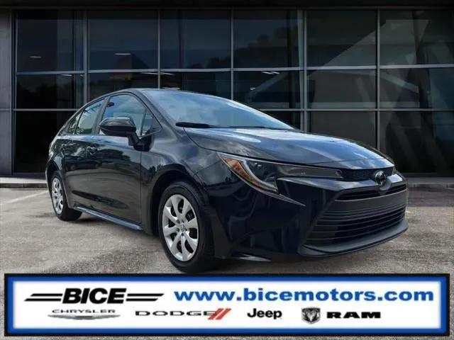 2024 Toyota Corolla LE in Midnight Black Metallic — front three-quarter view
