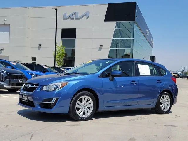 2016 Subaru Impreza 2.0i Premium in Quartz Blue Pearl — front three-quarter view