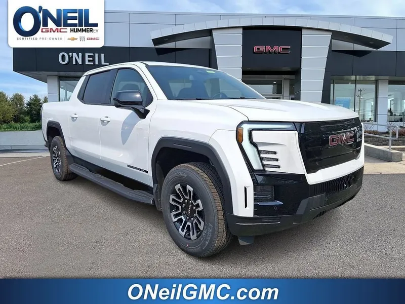 2026 GMC Sierra EV Elevation Standard Range in Summit White — front three-quarter view