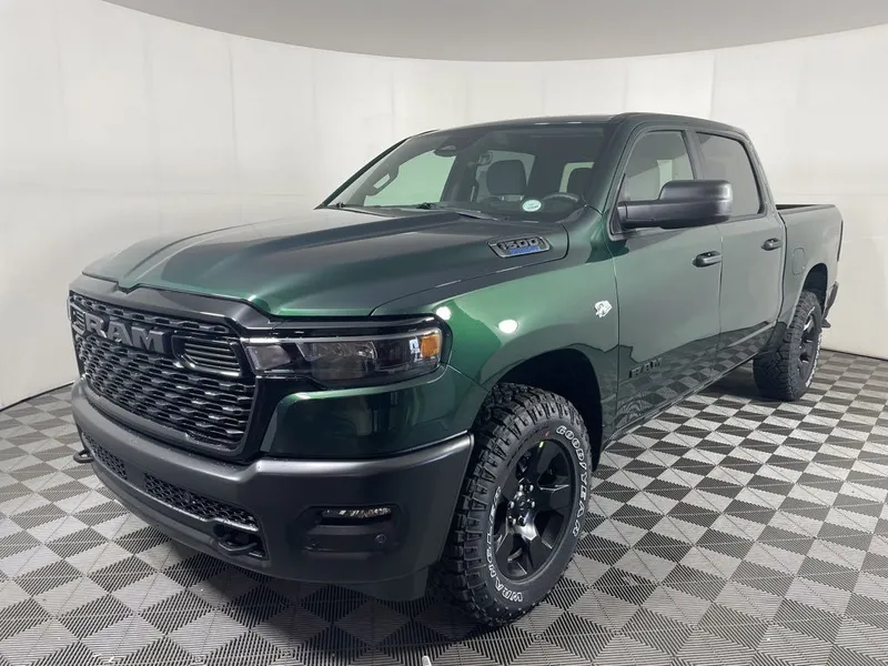 2026 RAM 1500 RAM 1500 WARLOCK CREW CAB 4X4 5'7' BOX in Serrano-Green Metallic Exterior Paint — front three-quarter view
