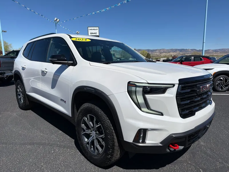 2024 GMC Acadia AT4 in White Frost Tricoat — front three-quarter view