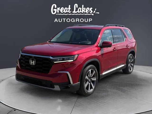 2023 Honda Pilot Elite in Radiant Red Metallic II — front three-quarter view