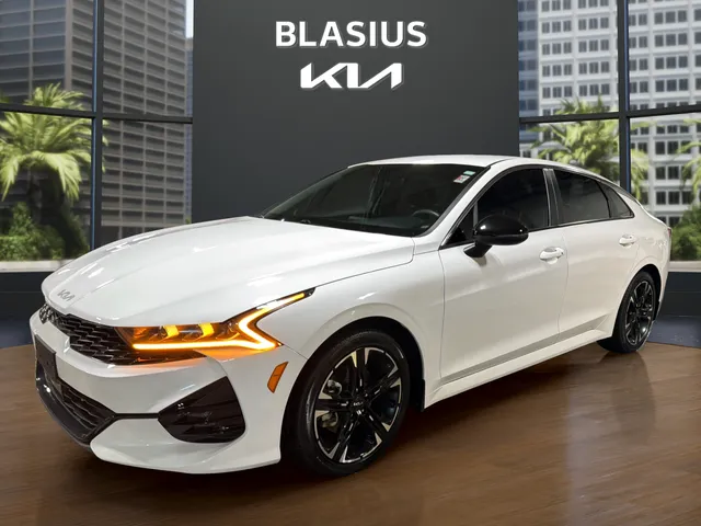 2024 Kia K5 GT-Line in Glacial White Pearl — front three-quarter view