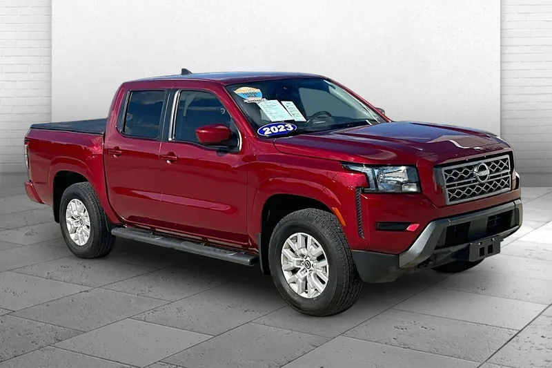 2023 Nissan Frontier SV in Cardinal Red Meta — front three-quarter view