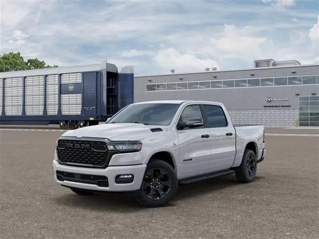 2026 RAM Ram 1500 RAM 1500 BIG HORN CREW CAB 4X4 5'7' BOX in Bright White Clear-Coat Exterior Paint — front three-quarter view