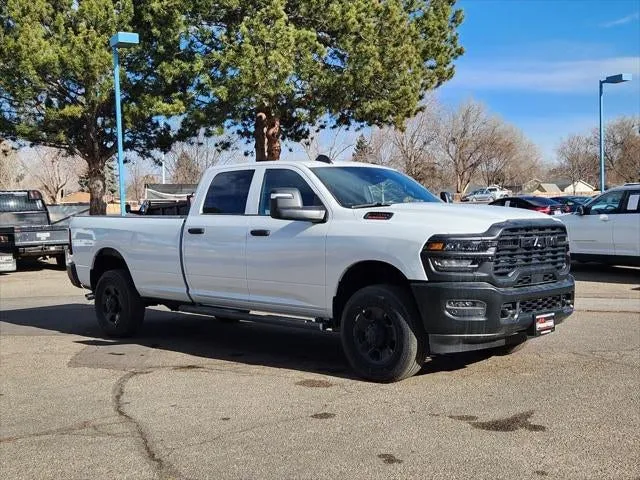 2026 RAM 2500 RAM 2500 TRADESMAN CREW CAB 4X4 8' BOX in Bright White Clear-Coat Exterior Paint — front three-quarter view