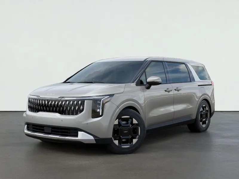 2026 Kia CARNIVAL EX in Ivory Silver — front three-quarter view