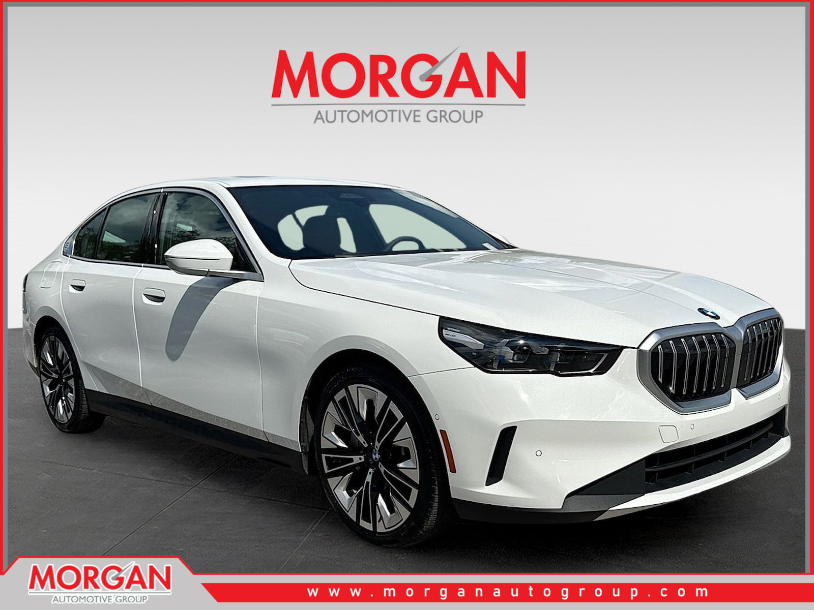 2026 BMW 5 Series 530i in Alpine White — front three-quarter view