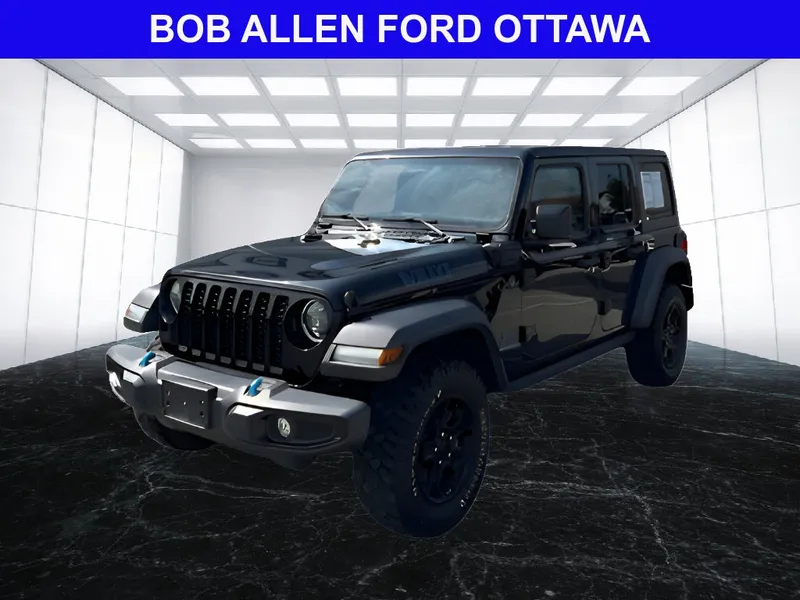 2023 Jeep Wrangler 4xe Willys 4xe in Black Clear Coat — front three-quarter view