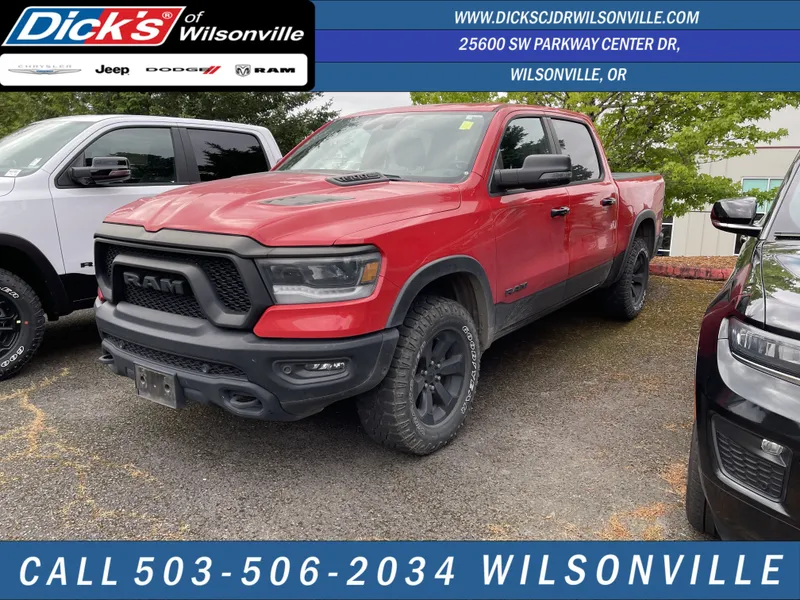 2023 RAM 1500 Rebel in Flame Red Clearcoat — front three-quarter view