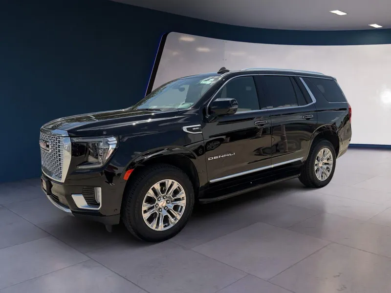 2024 GMC Yukon Denali in Onyx Black — front three-quarter view
