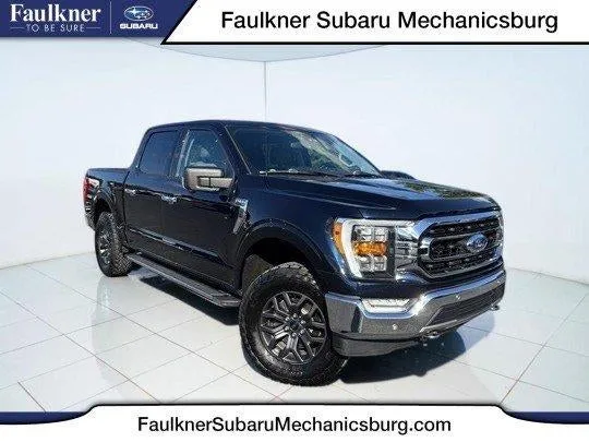 2021 Ford F-150 XLT 4WD SuperCrew 5.5' Box in Antimatter Blue Metallic — front three-quarter view