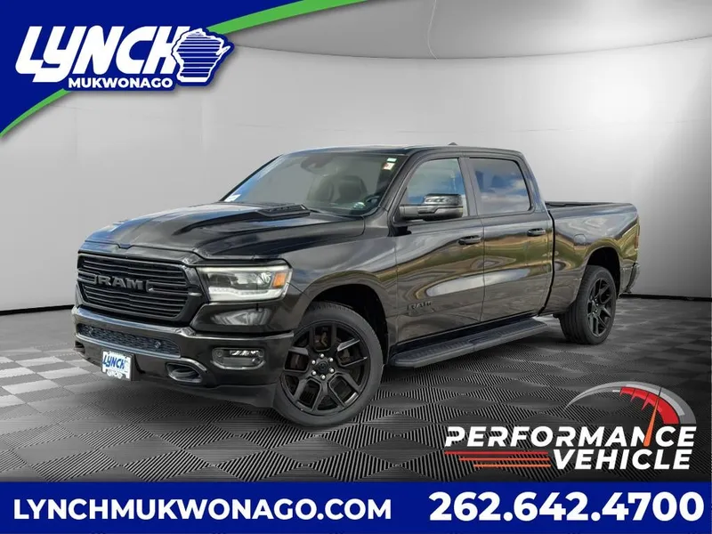 2023 RAM 1500 Laramie Night Edition w/Moonroof in Diamond Black Crystal Pearlcoat — front three-quarter view