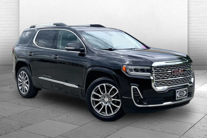 2023 GMC Acadia Denali in Ebony Twilight Metallic — front three-quarter view