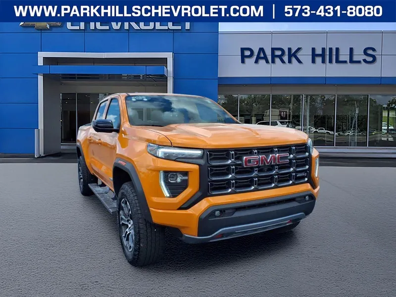 2025 GMC Canyon AT4 in Desert Sun — front three-quarter view