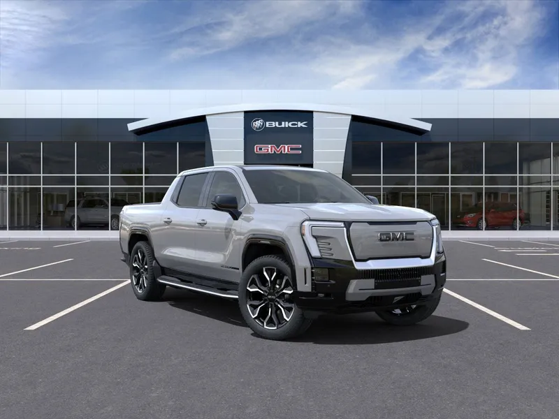 2024 GMC Sierra EV Denali Edition 1 in Thunderstorm Gray — front three-quarter view