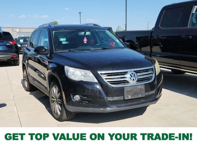 2011 Volkswagen Tiguan SE 4Motion in Black — front three-quarter view