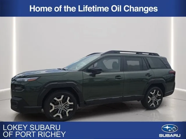 2026 Subaru Outback Touring XT in Deep Emerald Green Pearl — front three-quarter view
