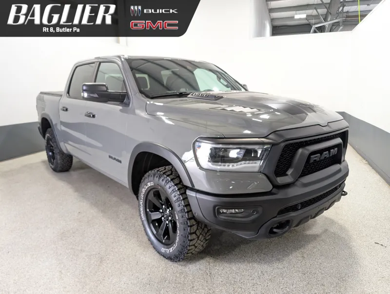 2023 RAM 1500 Rebel Crew Cab 4x4 5'7" Box in Gray — front three-quarter view