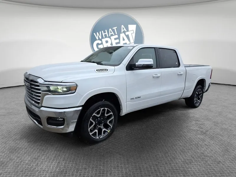 2026 RAM 1500 Laramie in Ivory White Tri-Coat Pearlcoat — front three-quarter view