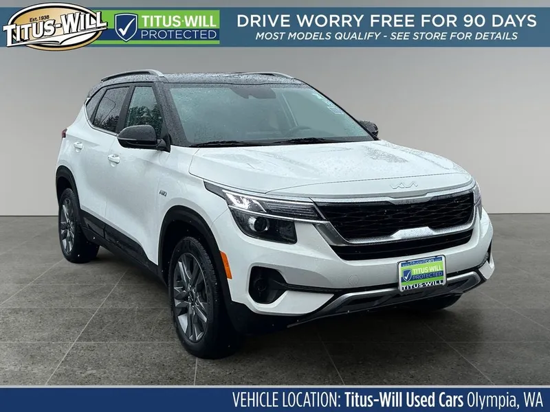 2023 Kia Seltos S in Clear White/Black Roof — front three-quarter view