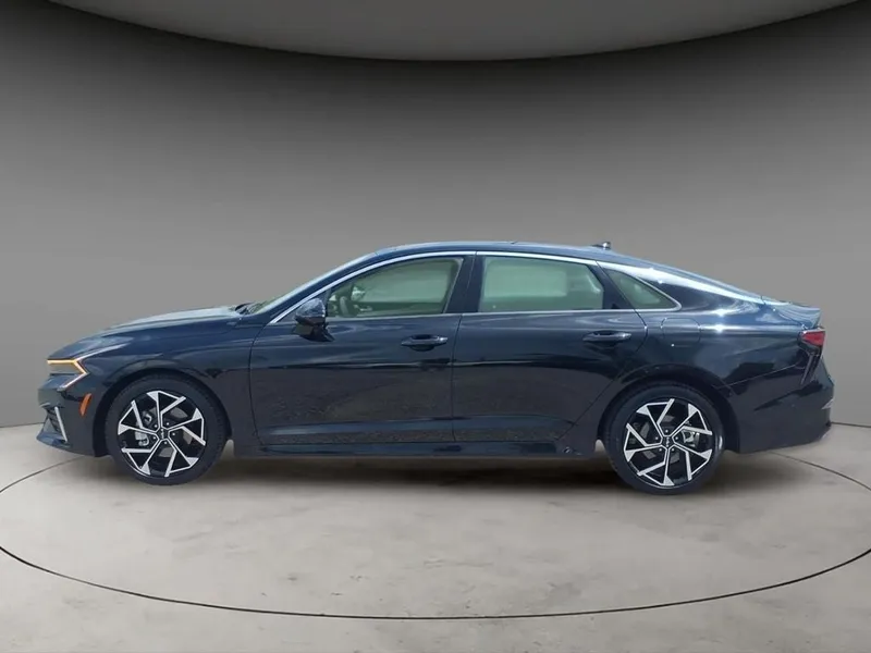 2025 Kia K5 EX in Aurora Black Pearl — front three-quarter view