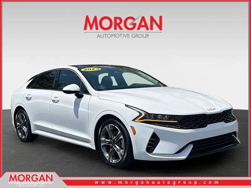 2023 Kia K5 EX in Glacial White Pearl — front three-quarter view