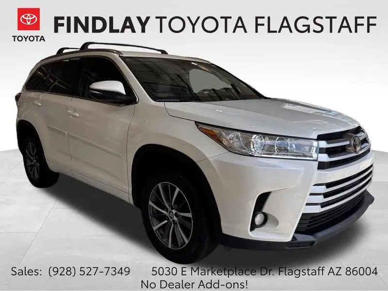 2018 Toyota Highlander XLE in Blizzard Pearl — front three-quarter view