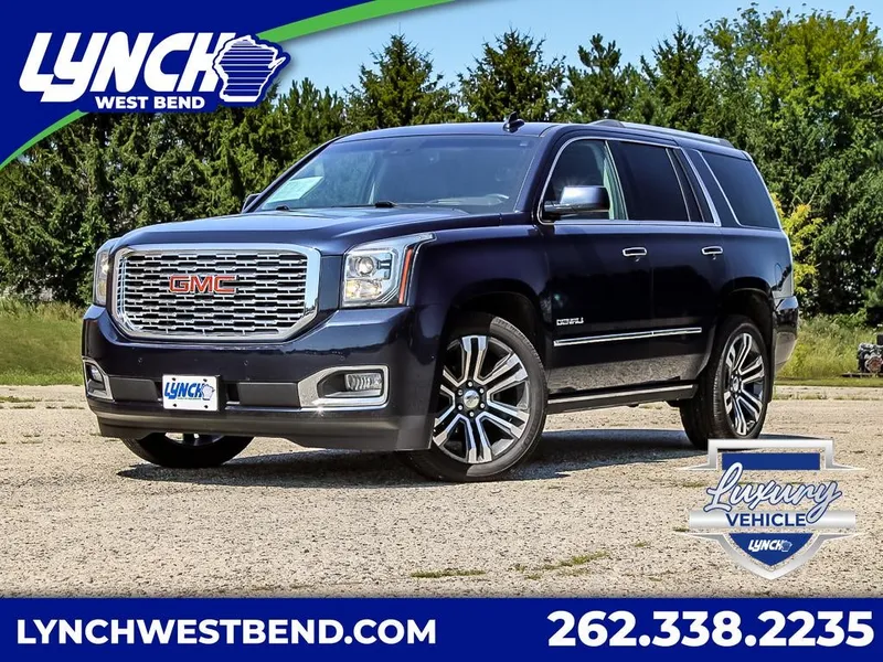 2018 GMC Yukon Denali in Dark Sapphire Blue Metallic — front three-quarter view