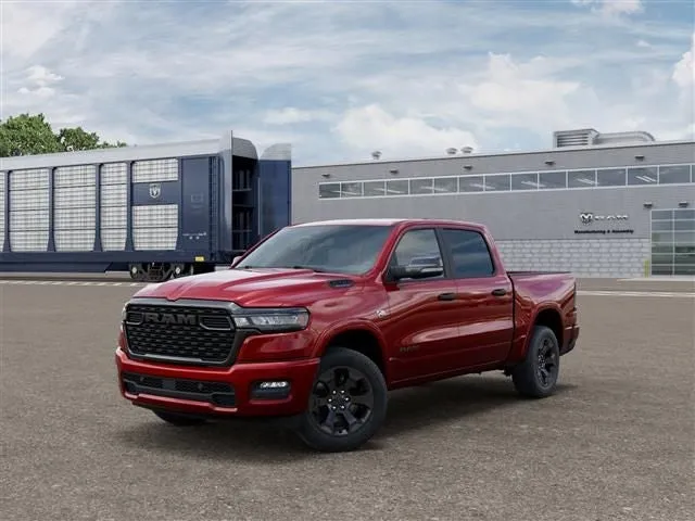 2026 RAM Ram 1500 RAM 1500 BIG HORN CREW CAB 4X4 5'7' BOX in Molten Red Pearl-Coat Exterior Paint — front three-quarter view