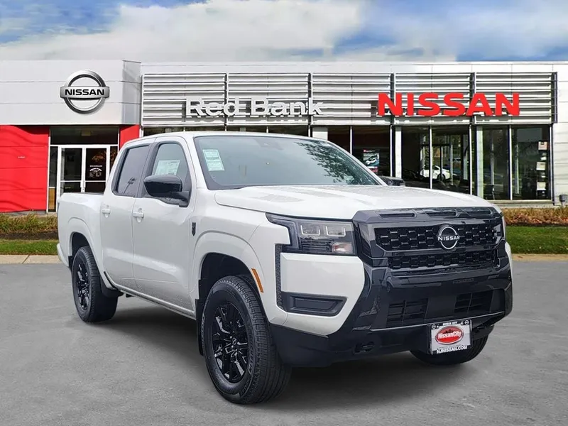 2026 Nissan Frontier SV in Glacier White — front three-quarter view