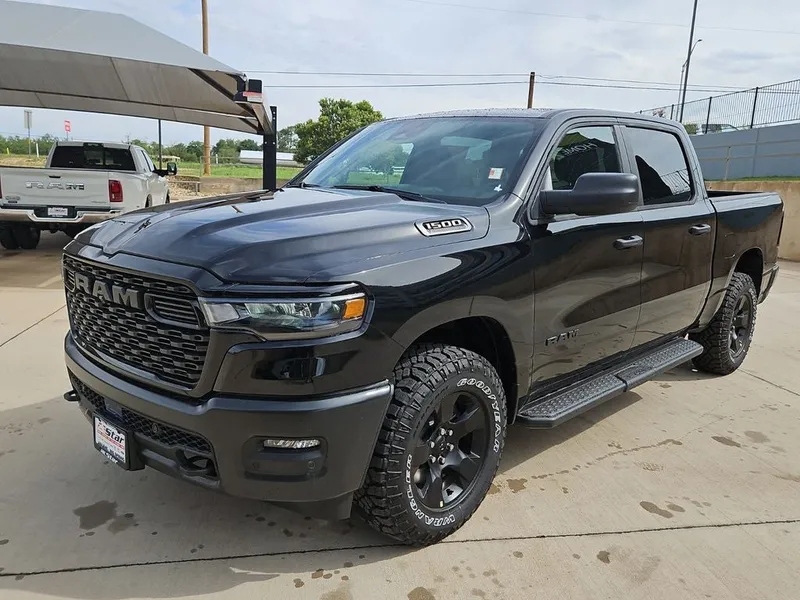 2026 RAM 1500 Warlock in Diamond Black Crystal Pearlcoat — front three-quarter view