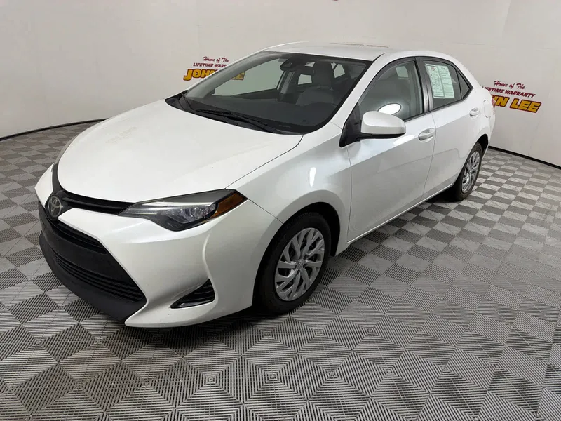 2017 Toyota Corolla LE in Blizzard Pearl — front three-quarter view