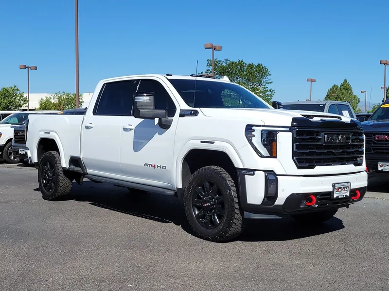 2024 GMC Sierra 2500HD AT4 in Summit White — front three-quarter view
