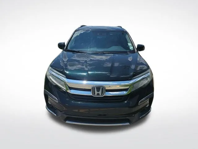 2019 Honda Pilot Touring 7 Passenger in Black Forest Pearl — front three-quarter view