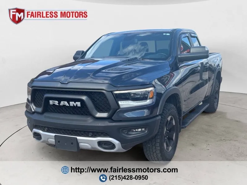 2019 RAM 1500 Rebel 4x4 4dr Quad Cab 6.4 ft. SB Pickup in Maximum Steel Metallic Clear Coat — front three-quarter view