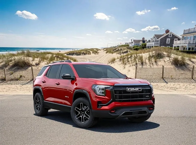 2026 GMC Terrain AT4 in Volcanic Red Tintcoat — front three-quarter view