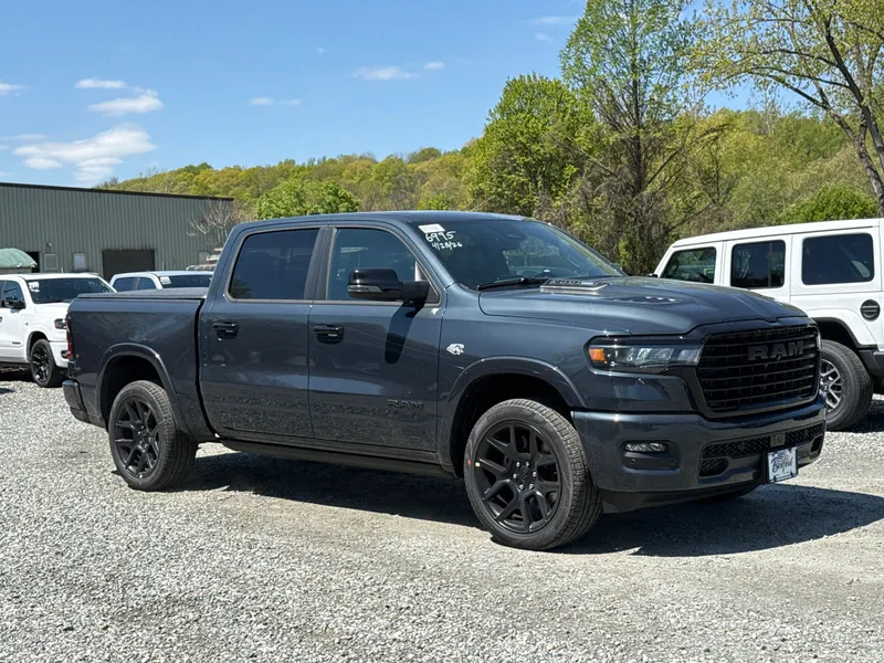 2026 RAM 1500 Laramie in Forged Blue Metallic — front three-quarter view