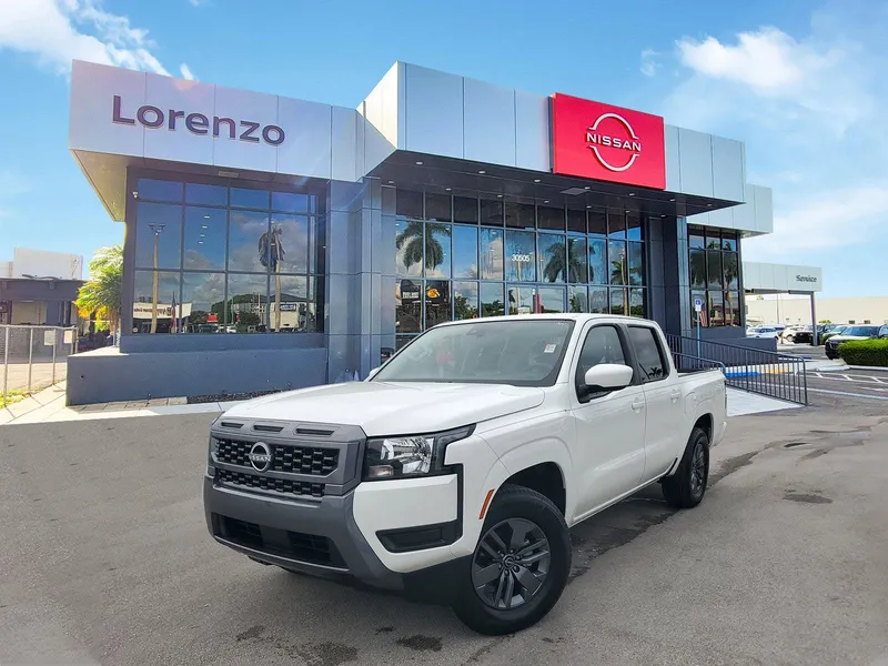 2025 Nissan Frontier Crew Cab SV in Glacier White — front three-quarter view