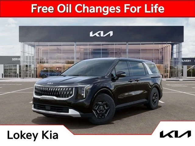 2026 Kia Carnival LXS in Aurora Black Pearl — front three-quarter view