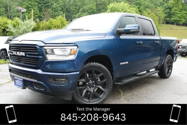 2023 RAM 1500 Laramie in Patriot Blue Pearlcoat — front three-quarter view