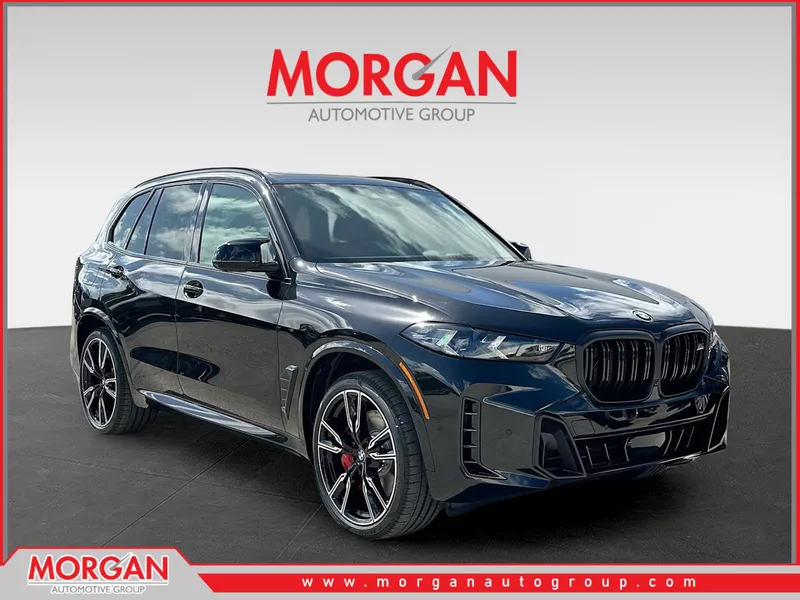 2026 BMW X5 M60i in Black Sapphire Metallic — front three-quarter view