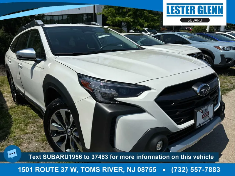 2024 Subaru Outback Touring in Crystal White Pearl — front three-quarter view