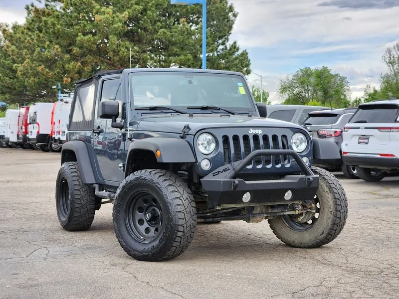 2016 Jeep Wrangler Sport in Rhino Clearcoat — front three-quarter view