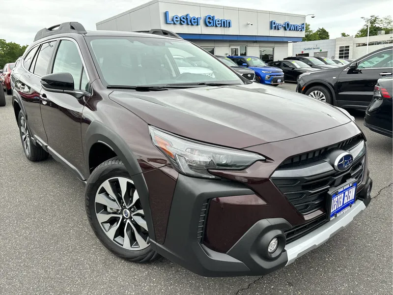 2025 Subaru Outback Limited in Dark Mahogany Pearl — front three-quarter view
