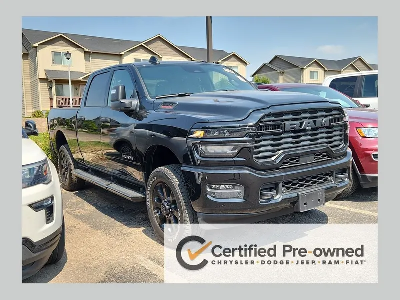 2025 RAM 2500 Big Horn Crew Cab 4x4 6'4' Box in Diamond Black Crystal Pearlcoat — front three-quarter view